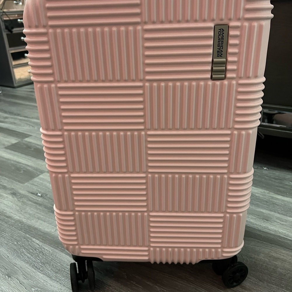 Brand new light pink suit case